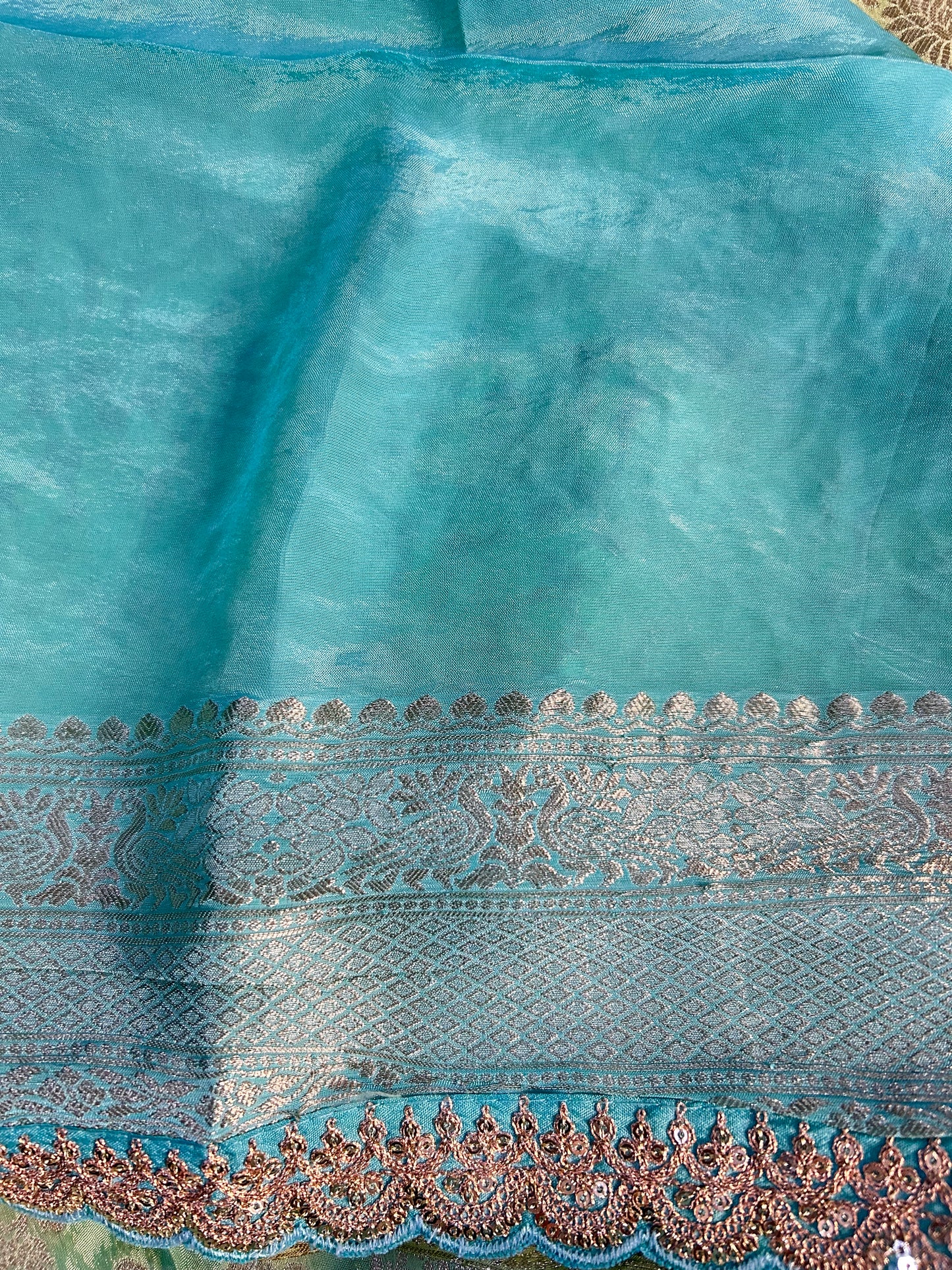 Blue-green brocade crepe saree
