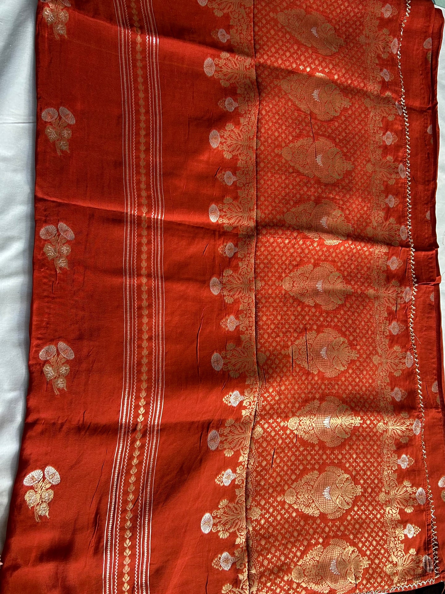 Rust orange chinon crepe saree